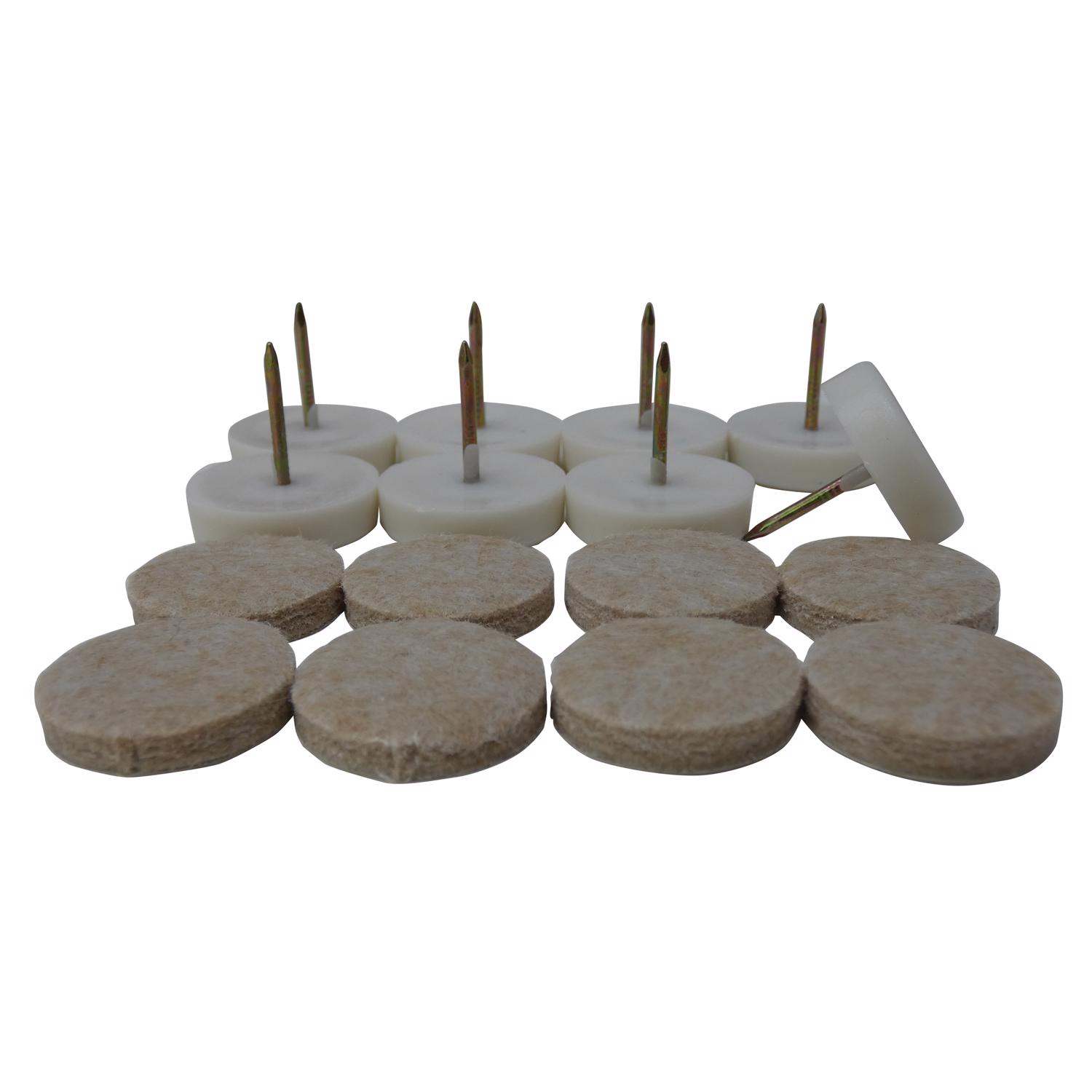 Assorted white felt pads with nails standing upright