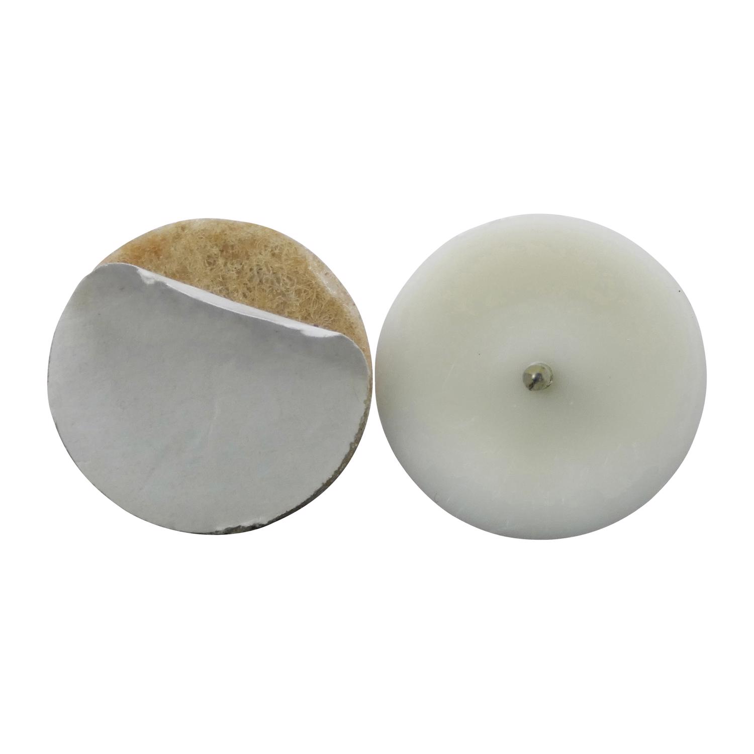 Two round pads, one with backing exposed
