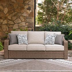 Signature Design by Ashley Carmel Bay Brown Aluminum Frame Casual Sofa Beige