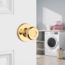 Kwikset Tylo Traditional Polished Brass Passage Lockset 1-3/4 in.