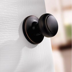 Kwikset Cove Venetian Bronze Passage Door Knob