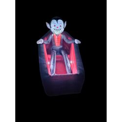 A Holiday Company 2.6 ft. LED Animated Rising Vampire in Coffin Inflatable